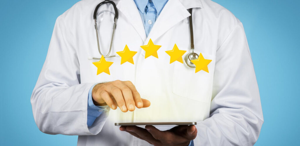 A doctor holds a tablet showing five stars - Webco Marketing Blogs