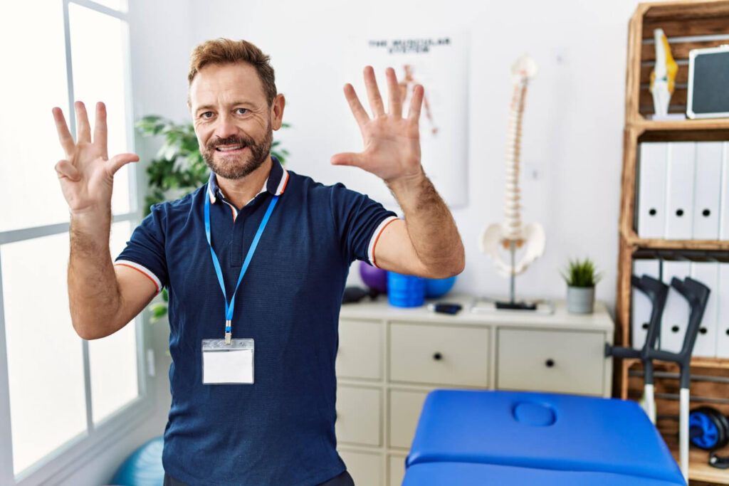 A physiotherapists in a blue shirt enthusiastically waves his hands expressing webco marketing blogs